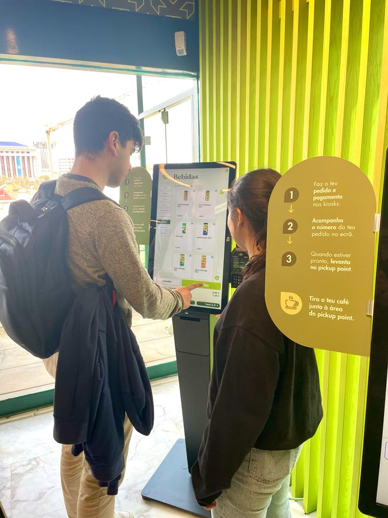 Customers ordering at the kiosk on launch day